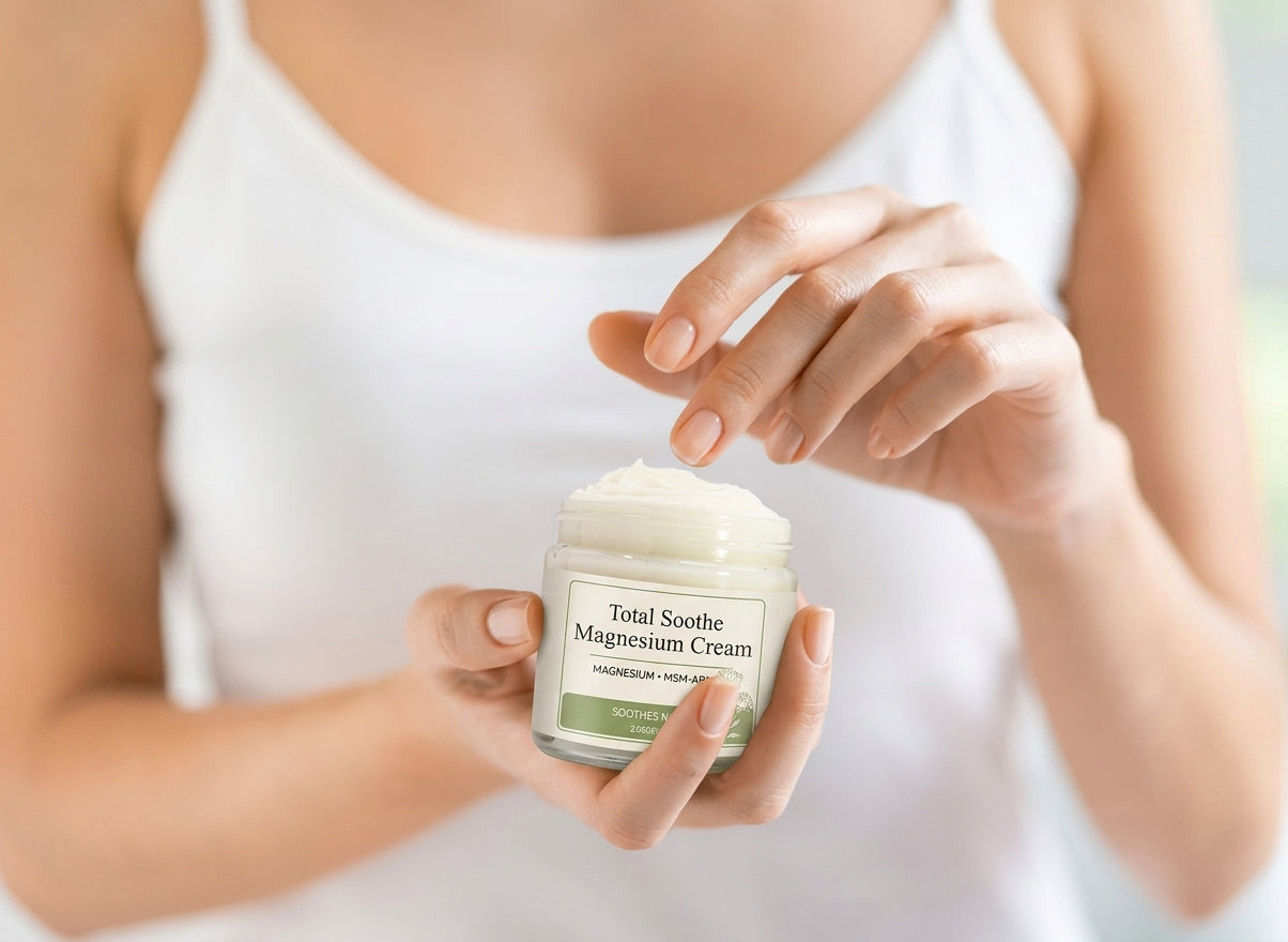 Woman opening a jar of Total Soothe Magnesium Cream
